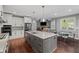 Spacious kitchen with an island, stainless steel appliances, and hardwood floors at 4035 Pinebrook Cir, Cumming, GA 30028