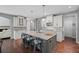 Elegant kitchen with an island, stainless steel appliances, and a view into the living room at 4035 Pinebrook Cir, Cumming, GA 30028