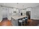 Modern kitchen with an island, stainless steel appliances, and gray and white cabinets at 4035 Pinebrook Cir, Cumming, GA 30028