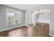 Bright and airy living room with hardwood floors, large windows, and detailed trim at 4035 Pinebrook Cir, Cumming, GA 30028