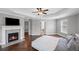 Large main bedroom with hardwood floors, a fireplace, and an ensuite bathroom at 4035 Pinebrook Cir, Cumming, GA 30028