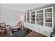 Spacious office with custom built-in shelving, wood floors, and comfortable seating at 4035 Pinebrook Cir, Cumming, GA 30028