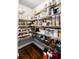 Well-organized pantry with wire shelving to maximize storage, and dark wood floors at 4035 Pinebrook Cir, Cumming, GA 30028
