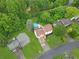 Charming home from above, showcasing its well-manicured lawn and inviting pool area with mature trees at 1105 Sallete Ct, Marietta, GA 30066
