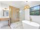 Stunning bathroom with a freestanding tub, walk-in shower, decorative lighting and vanity at 1105 Sallete Ct, Marietta, GA 30066
