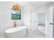Bright bathroom with a soaking tub, pendant light and a window at 1105 Sallete Ct, Marietta, GA 30066