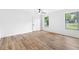Bright bedroom features laminate wood flooring and natural light from the large windows at 1105 Sallete Ct, Marietta, GA 30066