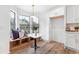 Bright breakfast nook features a bay window with bench seating, stylish light fixture, and cabinet storage at 1105 Sallete Ct, Marietta, GA 30066