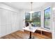 Bright breakfast nook features a bay window with bench seating, stylish light fixture, and wood-look floors at 1105 Sallete Ct, Marietta, GA 30066