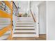 Inviting entryway with a staircase featuring white risers and wood treads, leading to the upper level at 1105 Sallete Ct, Marietta, GA 30066