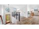 Bright hallway with modern railings, unique windows, and wood-look floors leading to the kitchen at 1105 Sallete Ct, Marietta, GA 30066