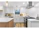 Modern kitchen with white cabinets, marble countertops, stainless steel appliances and a kitchen island at 1105 Sallete Ct, Marietta, GA 30066