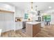 Bright kitchen with white cabinets, stainless steel appliances, island, and adjacent breakfast area at 1105 Sallete Ct, Marietta, GA 30066