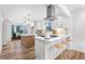 Modern kitchen with white cabinets, an island with seating, stainless steel appliances, and stylish lighting at 1105 Sallete Ct, Marietta, GA 30066