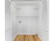 Laundry closet with white shelving and louvered doors at 1105 Sallete Ct, Marietta, GA 30066