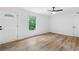 Bright living room features laminate wood flooring and a modern ceiling fan at 1105 Sallete Ct, Marietta, GA 30066