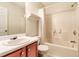 Neutral bathroom featuring a shower over tub with a white shower curtain, a single sink, and a wood vanity at 2204 Dresden Nw Grn, Kennesaw, GA 30144