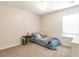 Small bedroom showcasing a cozy bed with blue bedding and a side table next to a window providing natural light at 2204 Dresden Nw Grn, Kennesaw, GA 30144