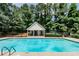 Inviting community pool with cabana, play area, and picnic tables, offering a perfect blend of relaxation and entertainment at 2204 Dresden Nw Grn, Kennesaw, GA 30144