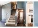 View of the entryway and staircase, with kitchen area visible on the right at 2204 Dresden Nw Grn, Kennesaw, GA 30144