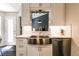 Modern kitchen features a stainless steel sink, white cabinets, and stylish backsplash, perfect for culinary enthusiasts at 2204 Dresden Nw Grn, Kennesaw, GA 30144