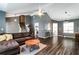 A spacious living room featuring hardwood floors, vaulted ceilings, and modern lighting fixtures for a sleek look at 2204 Dresden Nw Grn, Kennesaw, GA 30144