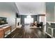 Bright living room with a cozy sitting area and fireplace, seamlessly connected to the adjacent kitchen at 2204 Dresden Nw Grn, Kennesaw, GA 30144