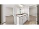 Bathroom with double sink vanity with granite countertop and neutral walls at 4093 Groveland Park Dr, Powder Springs, GA 30127