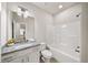 Bathroom featuring granite countertop vanity and a shower-tub at 4093 Groveland Park Dr, Powder Springs, GA 30127