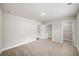 Bedroom with neutral carpet and three doors leading to other rooms at 4093 Groveland Park Dr, Powder Springs, GA 30127