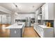 This kitchen features a central island and stainless steel appliances at 4093 Groveland Park Dr, Powder Springs, GA 30127