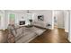 Bright living room with fireplace, neutral tones, hardwood flooring, and modern furniture at 4093 Groveland Park Dr, Powder Springs, GA 30127