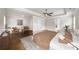 Spacious main bedroom features a tray ceiling, fan, hardwood flooring, and neutral color palette at 4093 Groveland Park Dr, Powder Springs, GA 30127