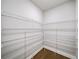 Spacious walk-in pantry with multiple shelves provides ample storage space at 4093 Groveland Park Dr, Powder Springs, GA 30127