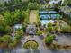 Aerial view of community clubhouse, tennis courts, basketball court, pool, and parking at 139 Lake Reserve Way, Canton, GA 30115