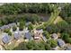 Aerial view of neighborhood featuring pond, walking trails and well-maintained homes at 139 Lake Reserve Way, Canton, GA 30115