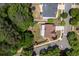 Aerial view of home on corner lot with fenced yard, patio, and mature landscaping at 139 Lake Reserve Way, Canton, GA 30115