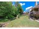 Lush private backyard with mature trees and manicured lawn at 139 Lake Reserve Way, Canton, GA 30115