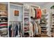 Spacious walk-in closet with custom shelving and ample storage for clothes and accessories at 139 Lake Reserve Way, Canton, GA 30115