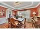 Inviting dining room with hardwood floors, a striking chandelier, and a window offering a pleasant view at 139 Lake Reserve Way, Canton, GA 30115