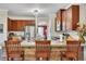Kitchen island featuring granite counters and wood bar with seating at 139 Lake Reserve Way, Canton, GA 30115
