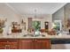 Granite counters accent a kitchen island with a double sink and stainless steel faucet at 139 Lake Reserve Way, Canton, GA 30115