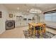 A charming kitchen features a dining area, modern appliances, and ample counter space at 139 Lake Reserve Way, Canton, GA 30115