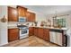 Well-equipped kitchen featuring stainless steel appliances, granite countertops, and abundant cabinet space at 139 Lake Reserve Way, Canton, GA 30115