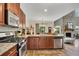 Modern kitchen with granite counters, stainless steel appliances, and an open layout at 139 Lake Reserve Way, Canton, GA 30115