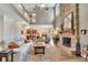 Open living space featuring a stone fireplace and vaulted ceilings at 139 Lake Reserve Way, Canton, GA 30115