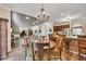 Open-concept living room, kitchen, and dining area with wood floors and modern decor at 139 Lake Reserve Way, Canton, GA 30115