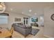 The inviting living room is complete with a comfortable sofa, TV, and natural light at 139 Lake Reserve Way, Canton, GA 30115