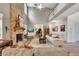 Living room with stone fireplace, high ceilings, wood floors, and piano at 139 Lake Reserve Way, Canton, GA 30115