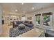 The welcoming living area offers ample seating and access to outdoor spaces and a kitchen at 139 Lake Reserve Way, Canton, GA 30115